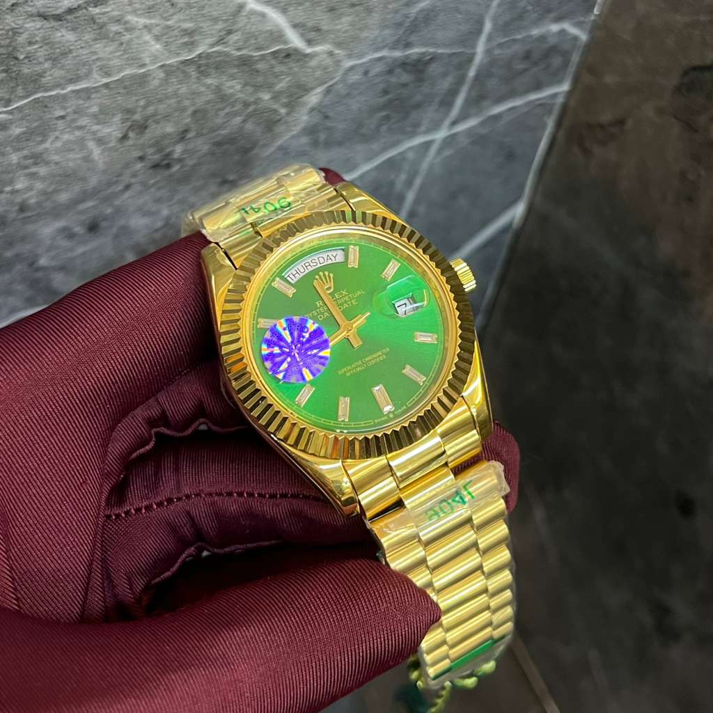 Rolex Day-Date Gold Watch with a Green Dial