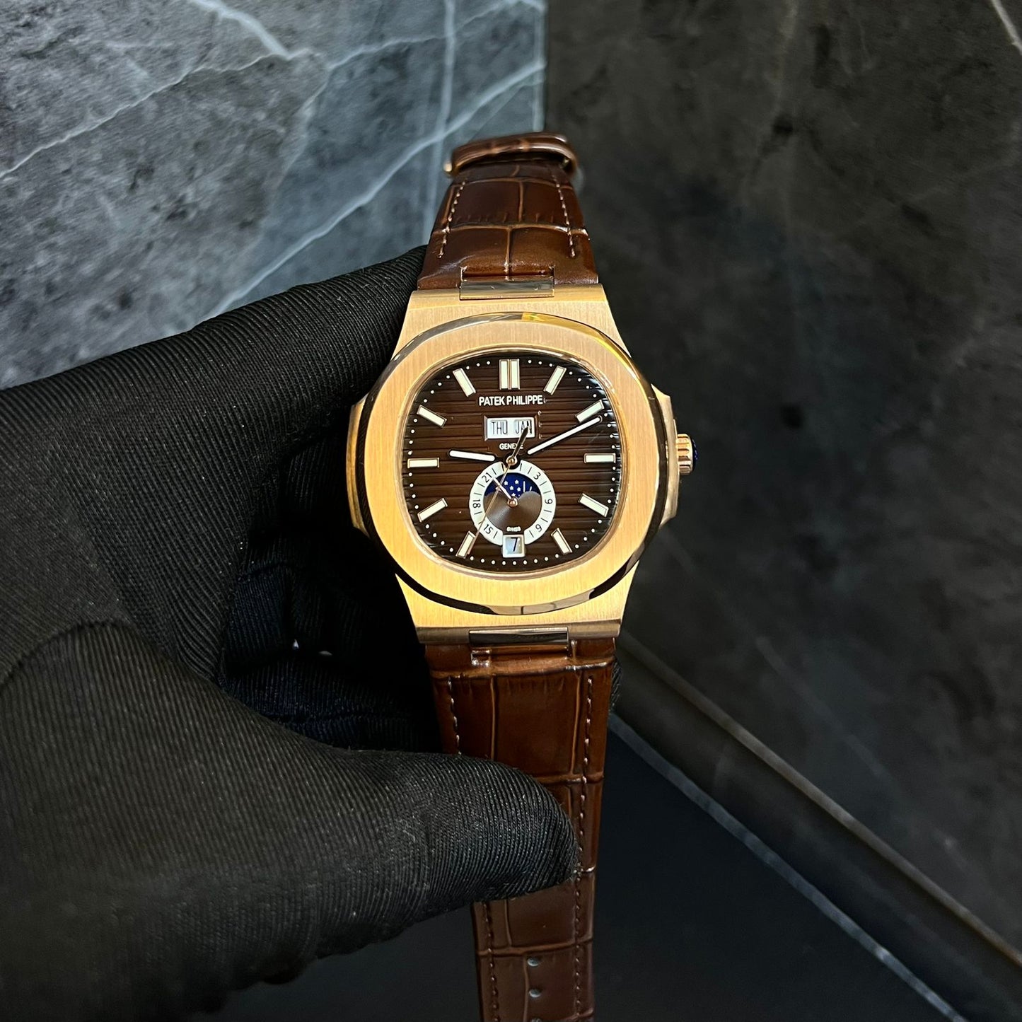 Patek Philippe Nautilus Ref 5712/1R-001 Watch in Rose Gold with a Brown Sunbrust Dial