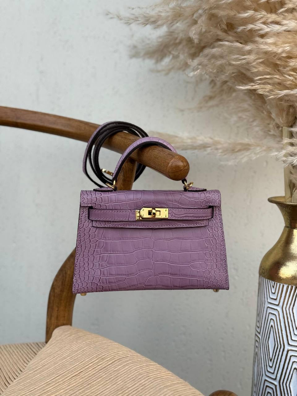 Hermés Kelly Bag In a Purple Crocodile Pattern Leather
