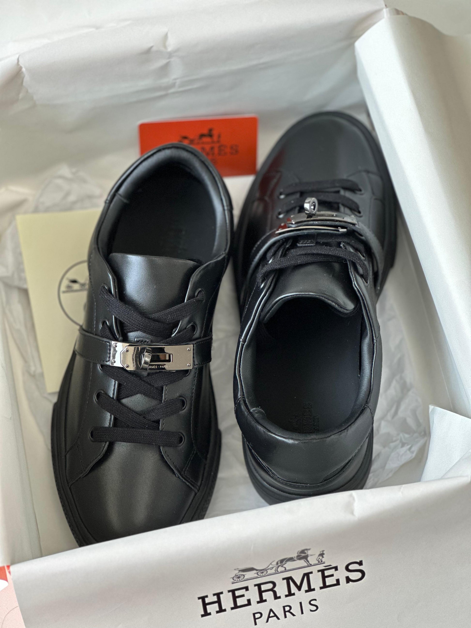 Hermès Day Sneaker in Black Calfskin with Kelly Buckle – Modern Urban Leather Sneaker.