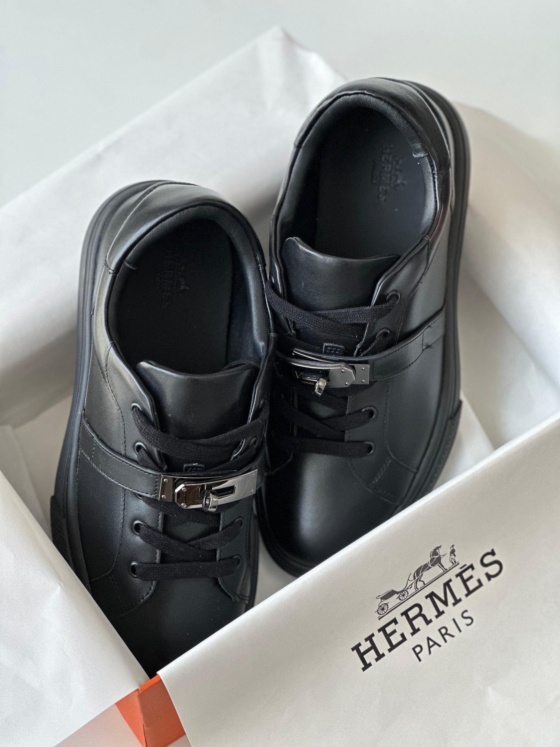 Hermès Day Sneaker in Black Calfskin with Kelly Buckle – Modern Urban Leather Sneaker.