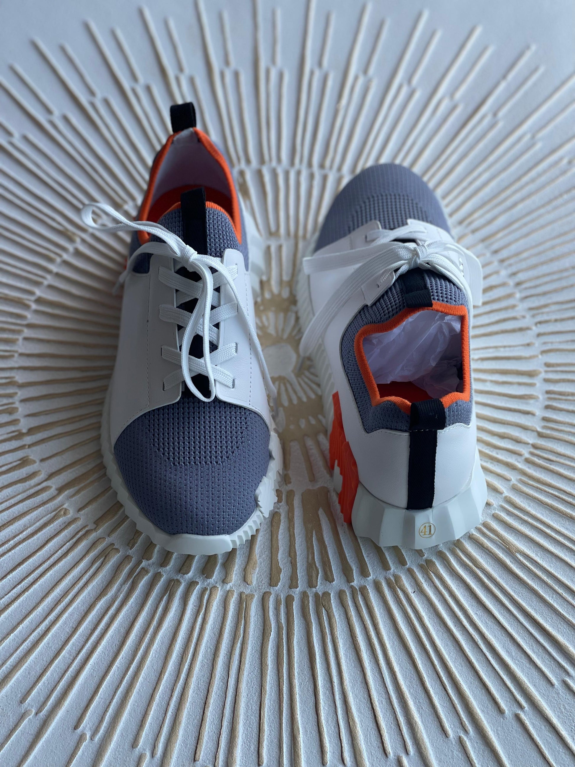 Hermès Depart Slip-On Sneaker – Knit & Calfskin Minimalist Design with Signature Orange Edge