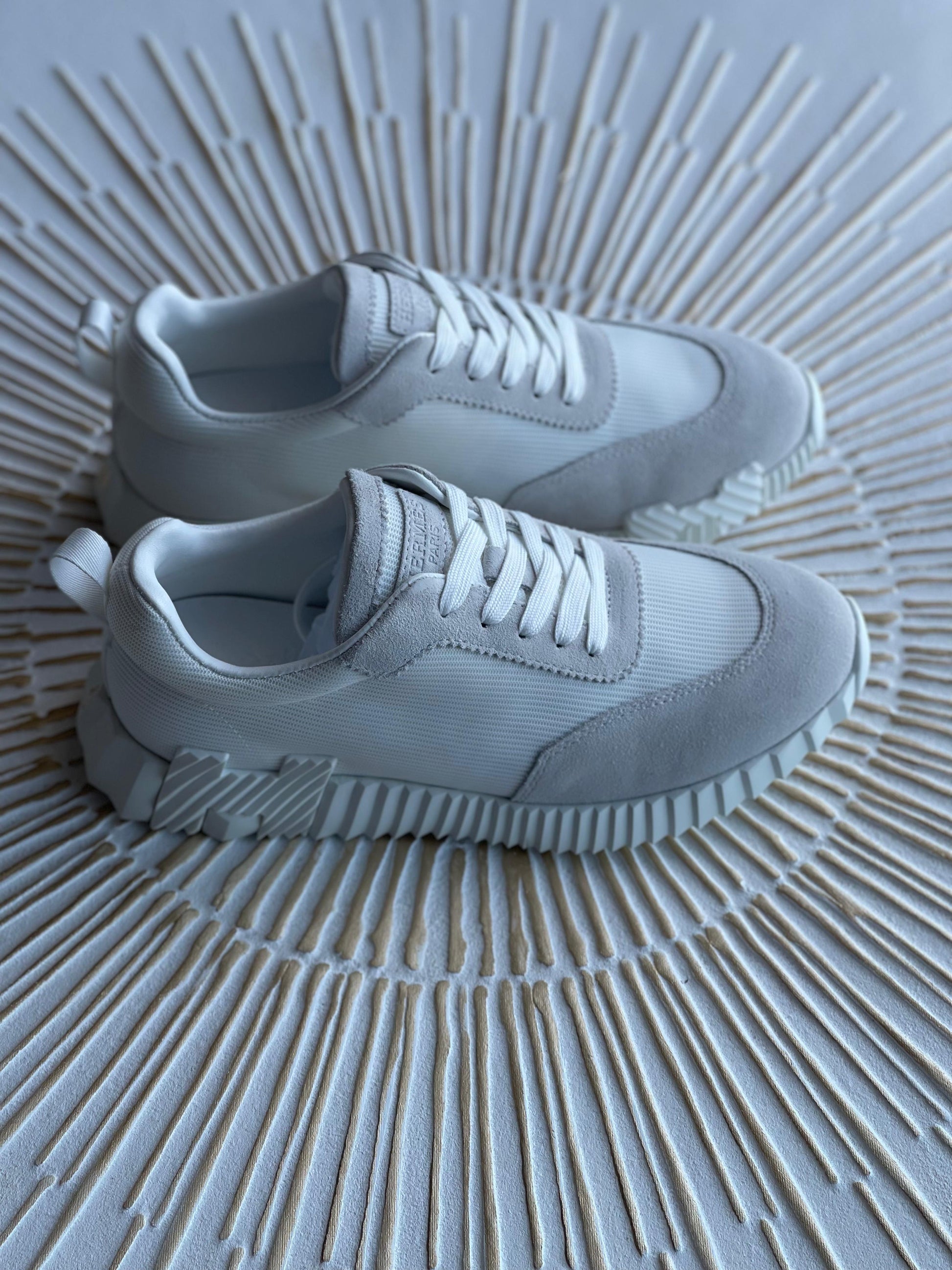 Hermès Paris Bouncing Sneaker in Triple White – All-White Calfskin & Mesh Urban Sneaker.