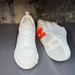 Hermés Bouncing Sneakers in a White Colorway with an Orange H Logo On The Sole