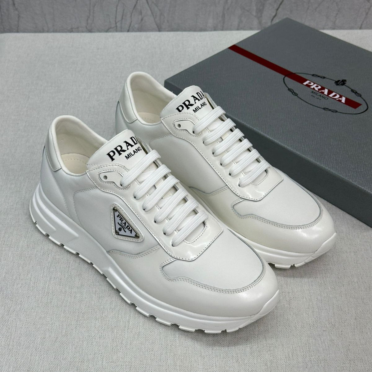 Prada PRAX 01 Sneakers – White Re-Nylon & Brushed Leather