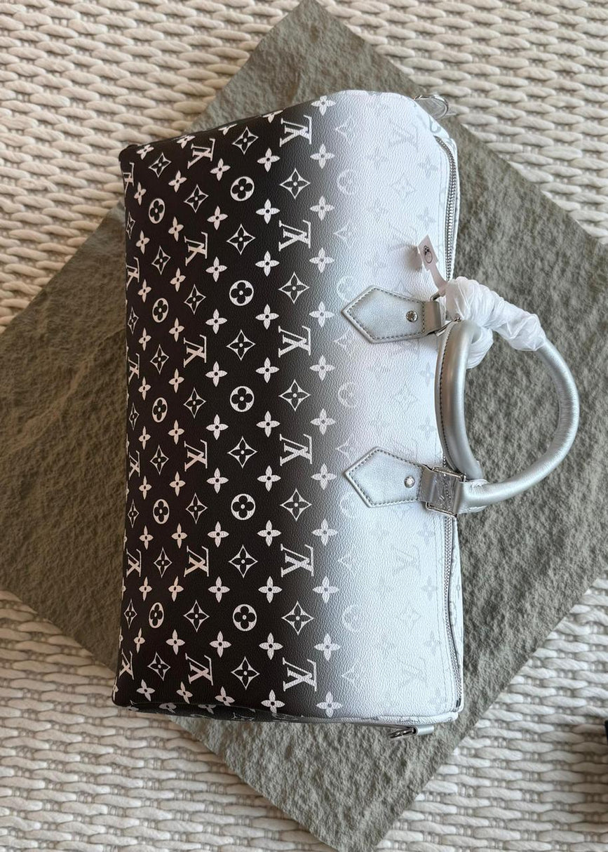 Louis Vuitton Keepal Bandouliére 50, Possibly in a Metallic Silver Monogram Finish