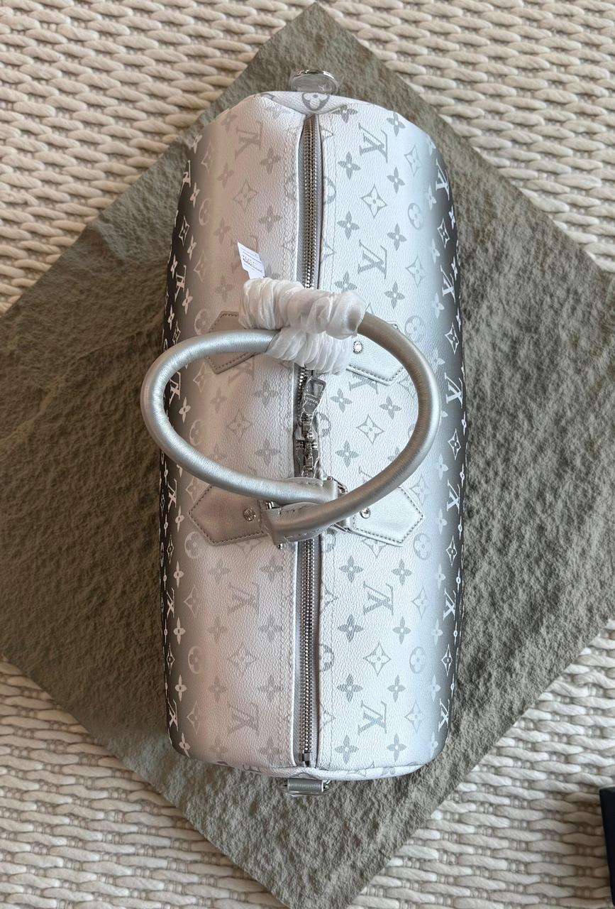 Louis Vuitton Keepal Bandouliére 50, Possibly in a Metallic Silver Monogram Finish