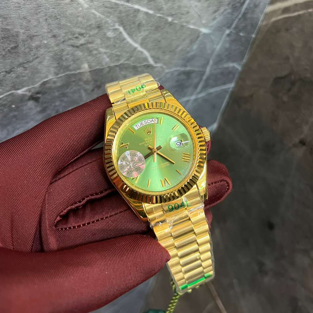 Gold-Toned Rolex Day-Date 40 with a Fluted Bezel and a Green Dial